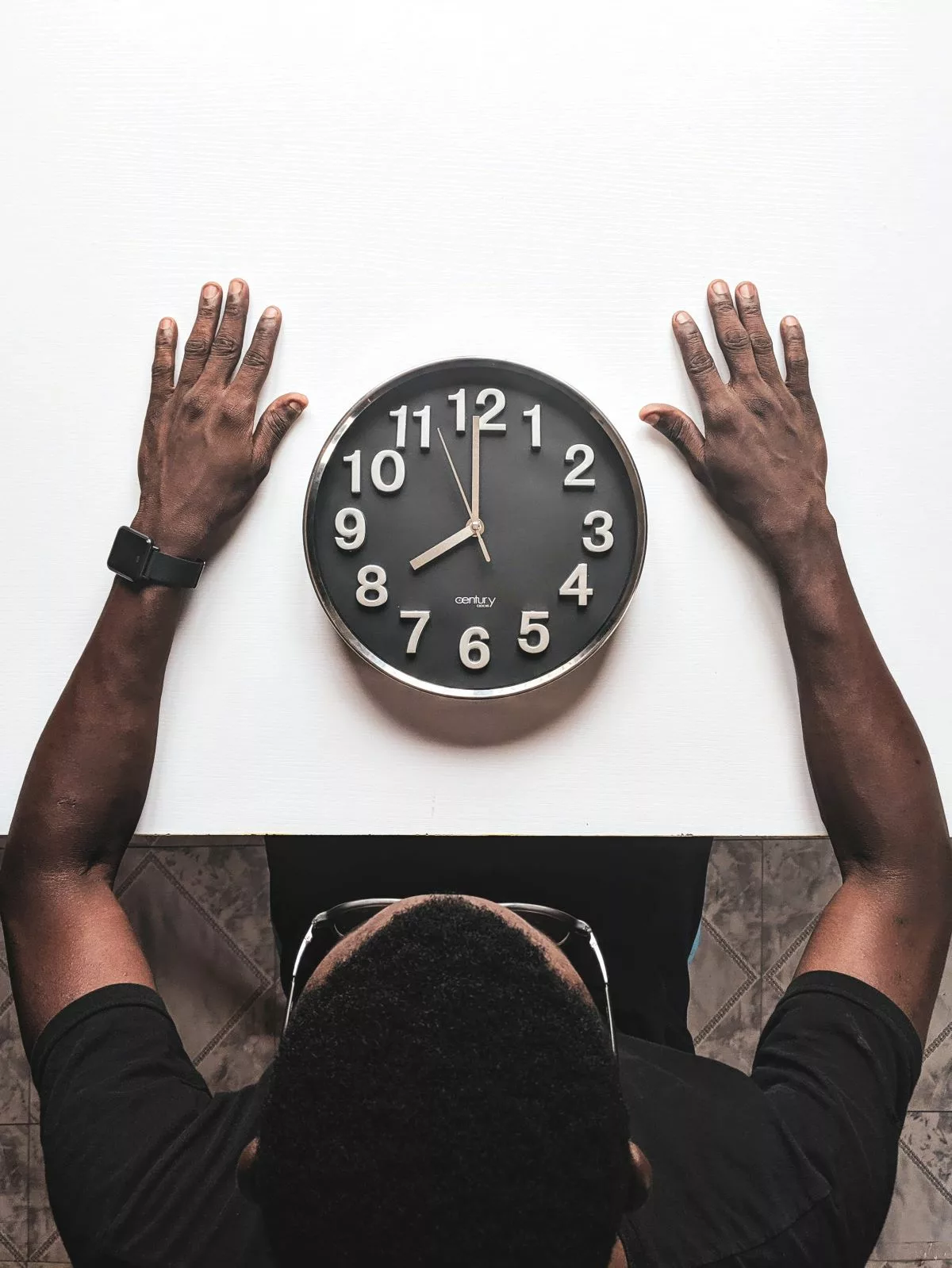 man starting at a clock