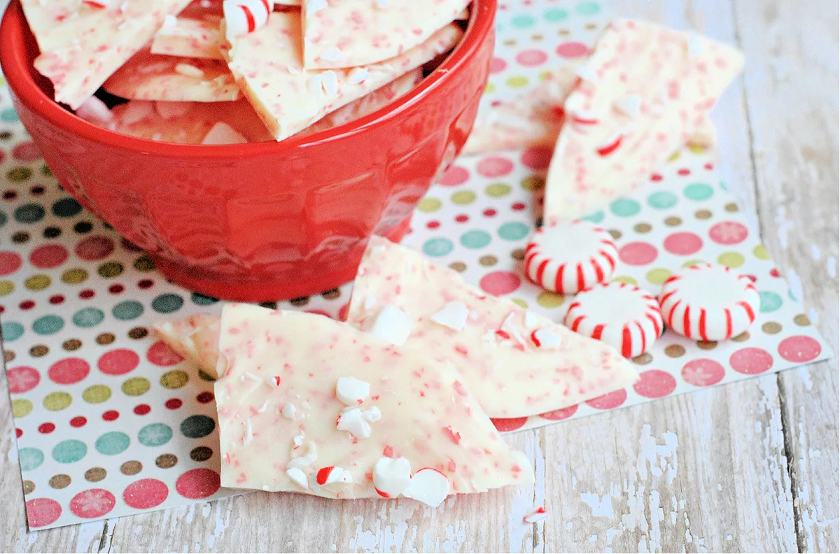 white chocolate Peppermint Bark in a red bowl with starlight mints 