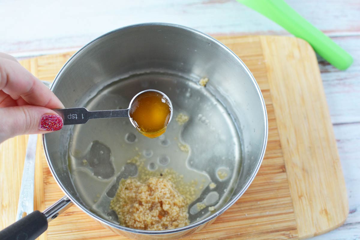 Overhead shot of glaze ingredients being added to a pot. 