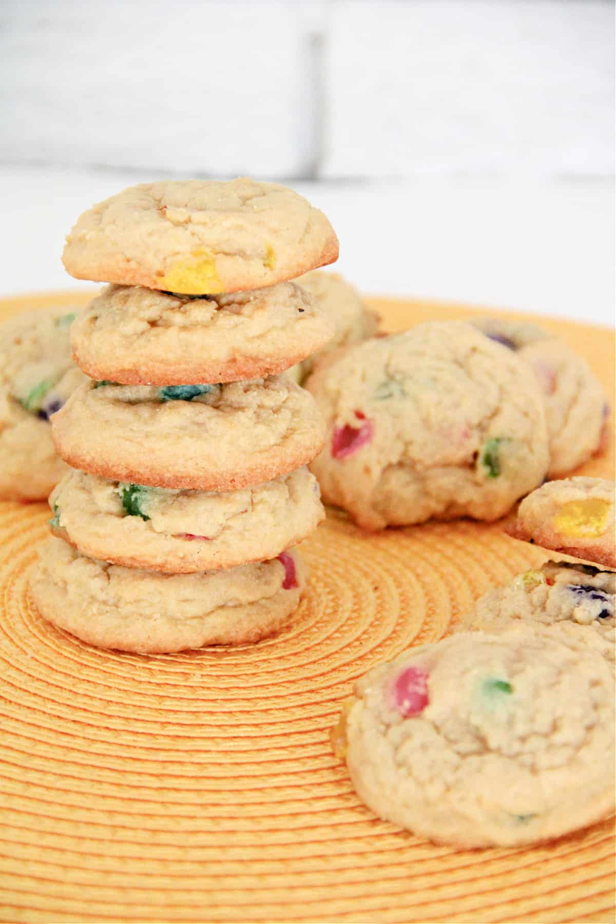 Stack of jelly bean cookies surrounded by more jelly bean cookies. 