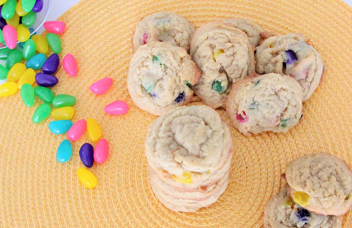 Overhead shot of colorful jelly bean cookies with jelly beans next to them. 