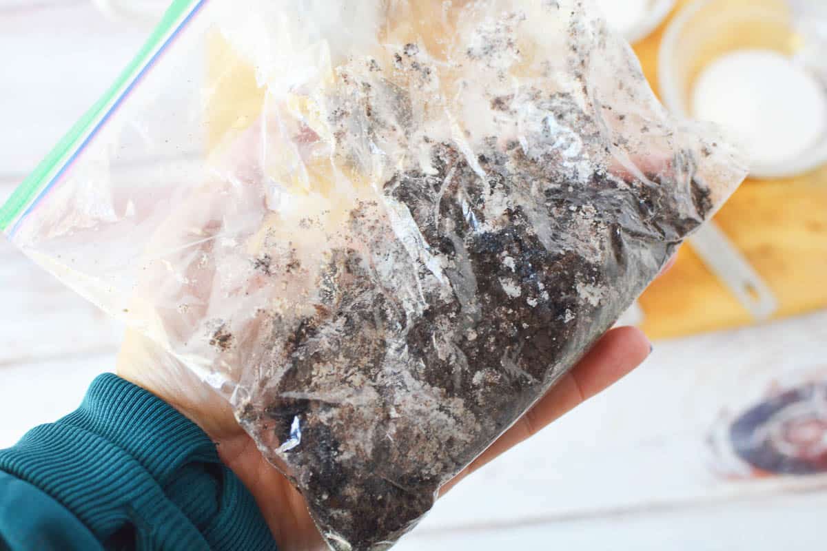 Crushed Oreos in a baggie. 