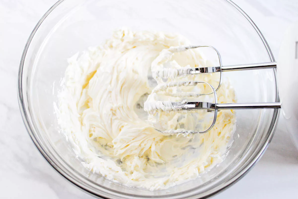 Homemade vanilla buttercream frosting in a mixing bowl. 