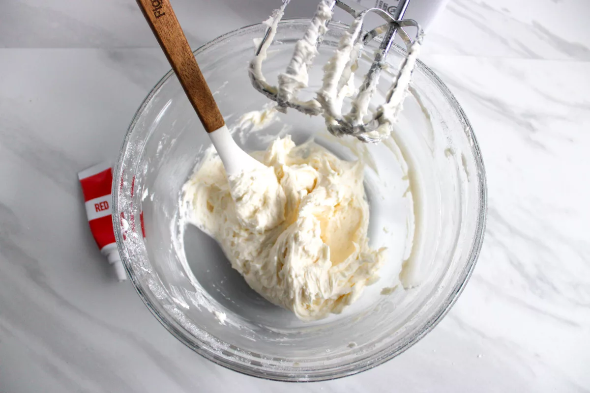 vanilla buttercream being mixed in a bowl