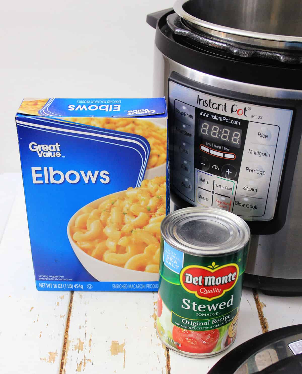 box of elbow noodles, can of stewed tomatoes and an Instant Pot