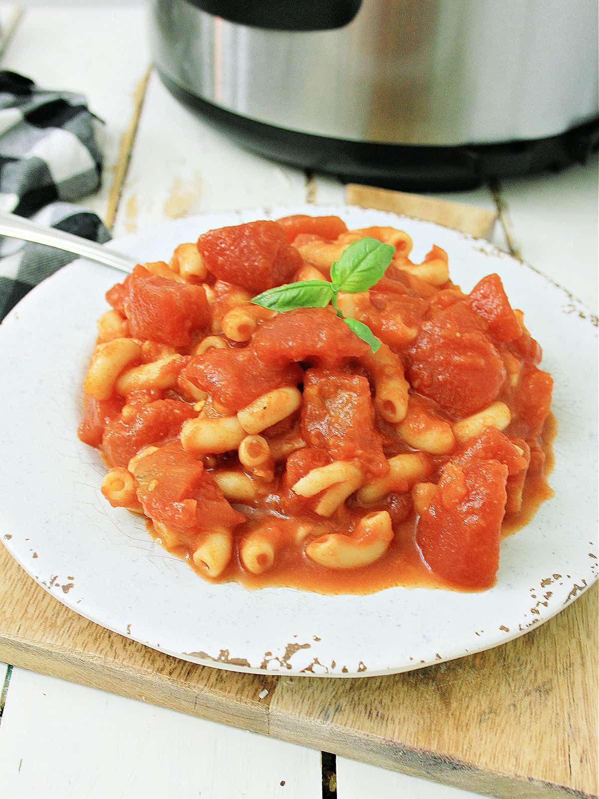overhead shot of Macaroni and Tomatoes in a white bowl 