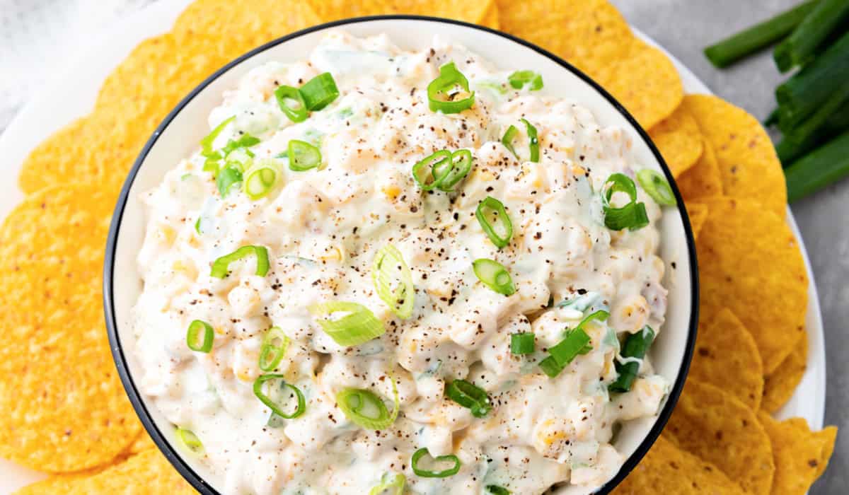 Crack Corn Dip in a bowl with crackers