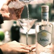 martini being poured into a glass