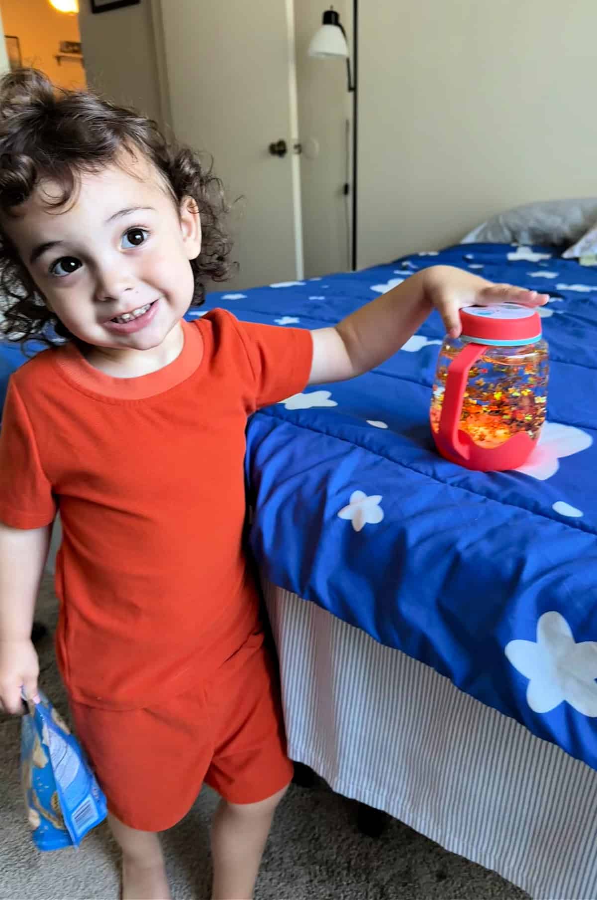 little boy playing with sensory toys