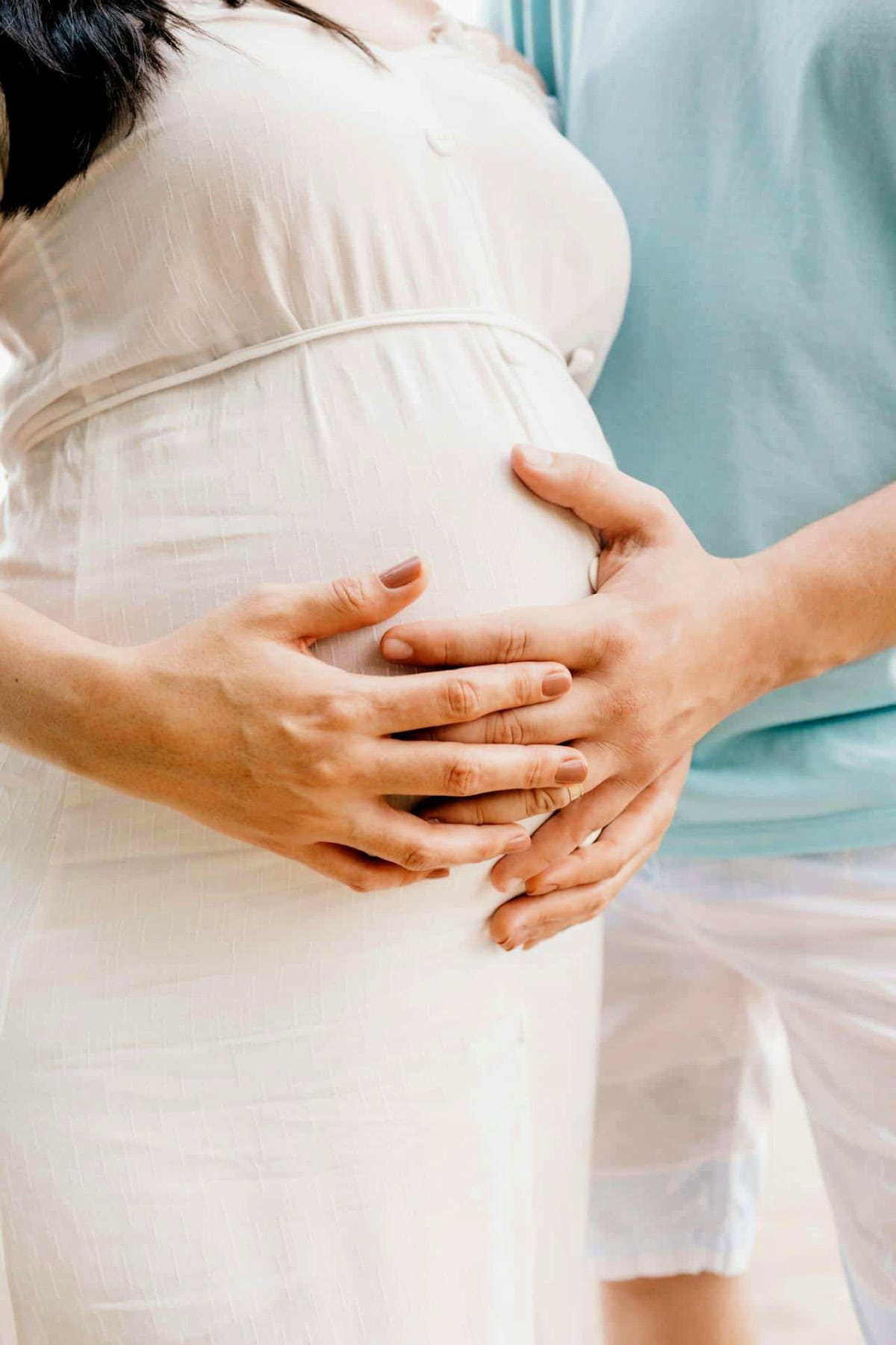 pregnant belly with hands on it