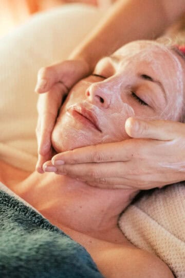 close up of a woman getting a facial at a spa