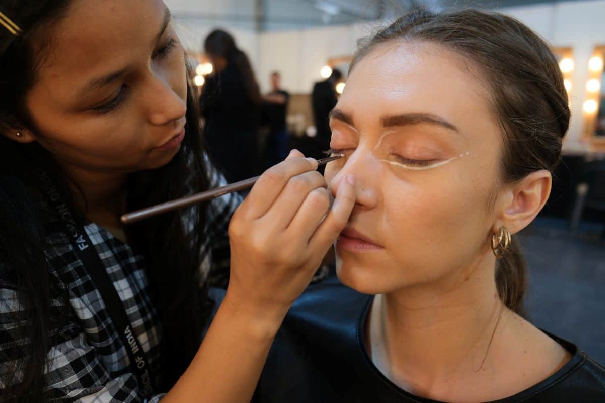 woman getting her makeup done at a salon