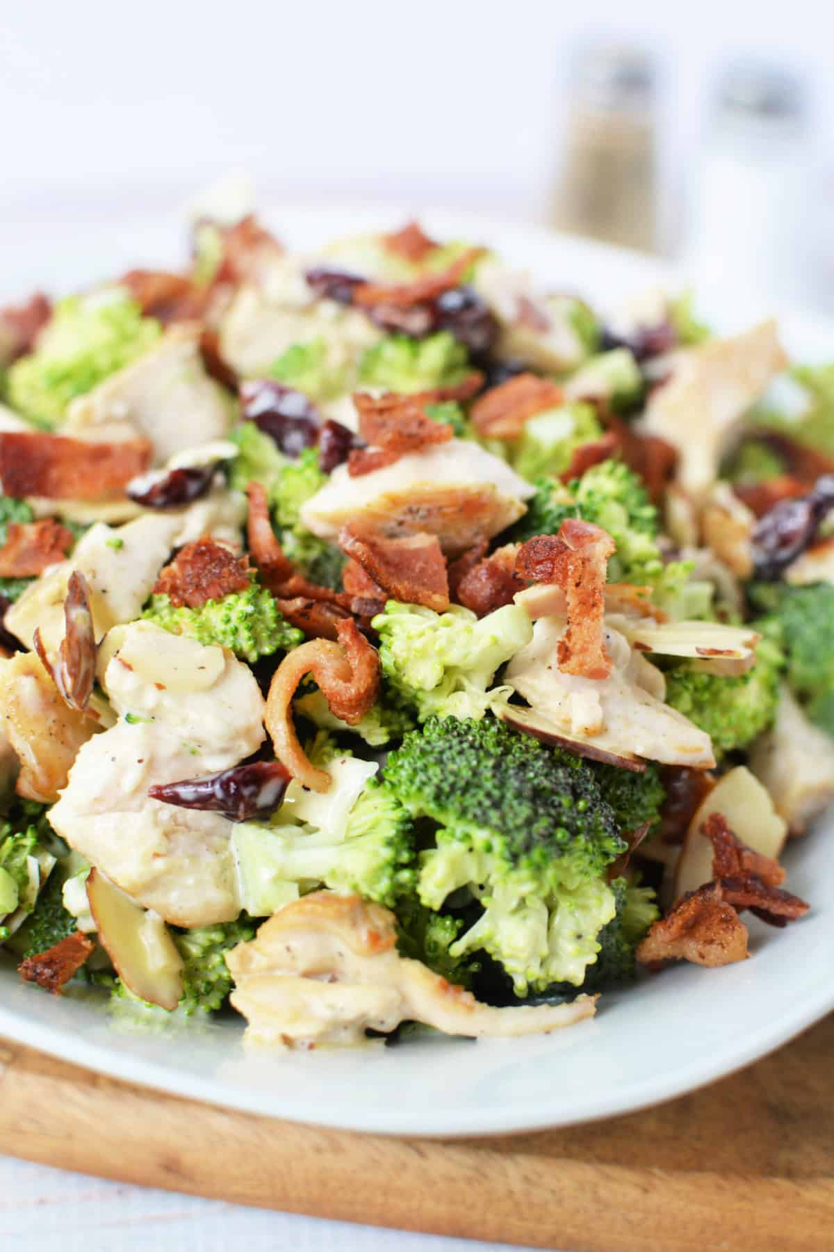 overhead close up shot of Broccoli Chicken Salad on a white plate