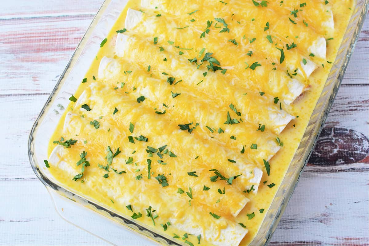 Sour Cream Enchiladas in a glass casserole dish