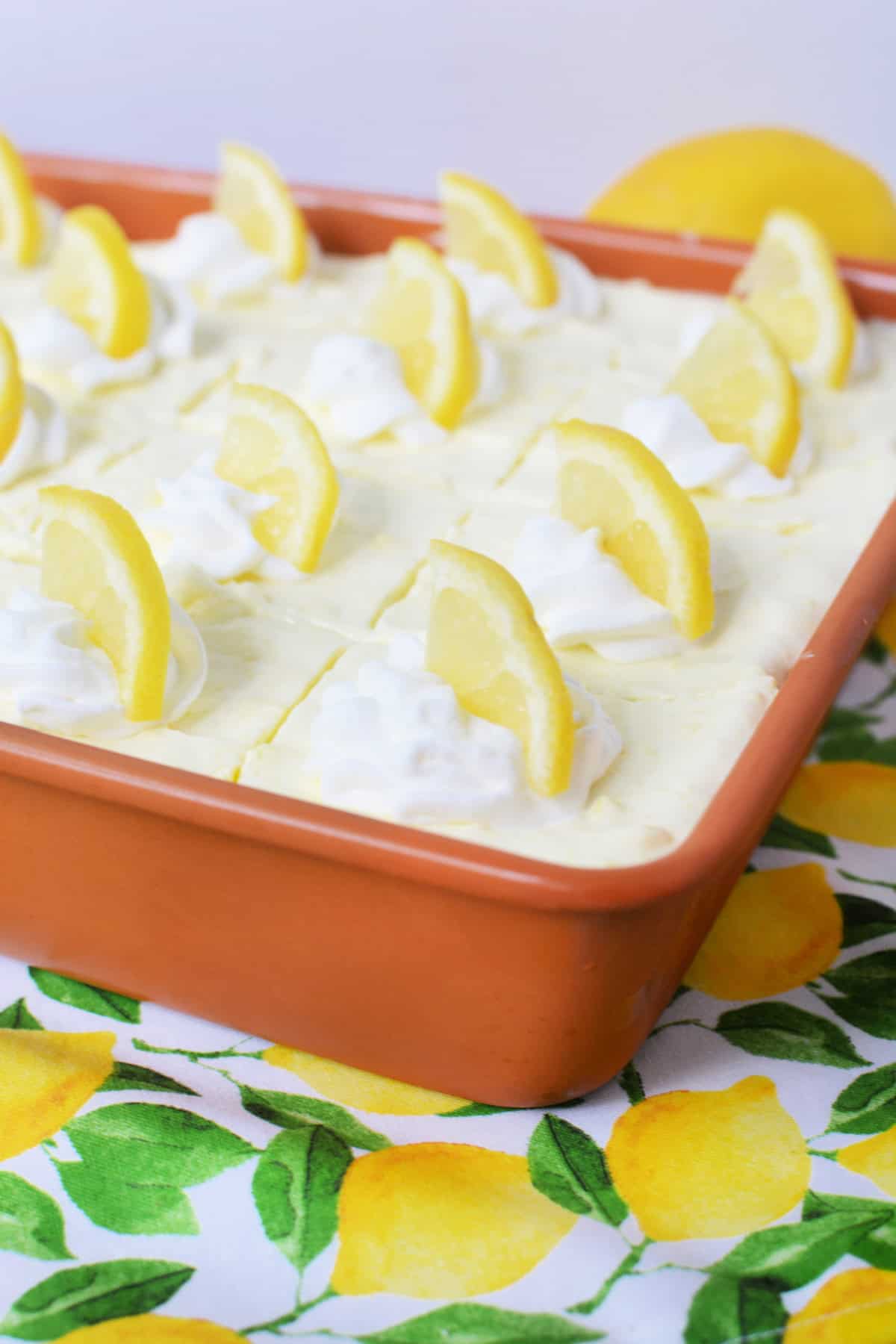Lemon Icebox Cake with Graham Crackers with lemon slices on top
