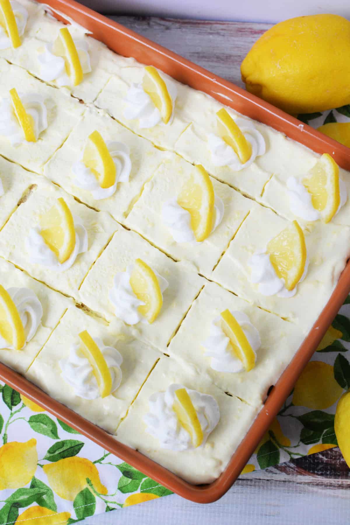Lemon Icebox Cake with Graham Crackers with lemon slices on top