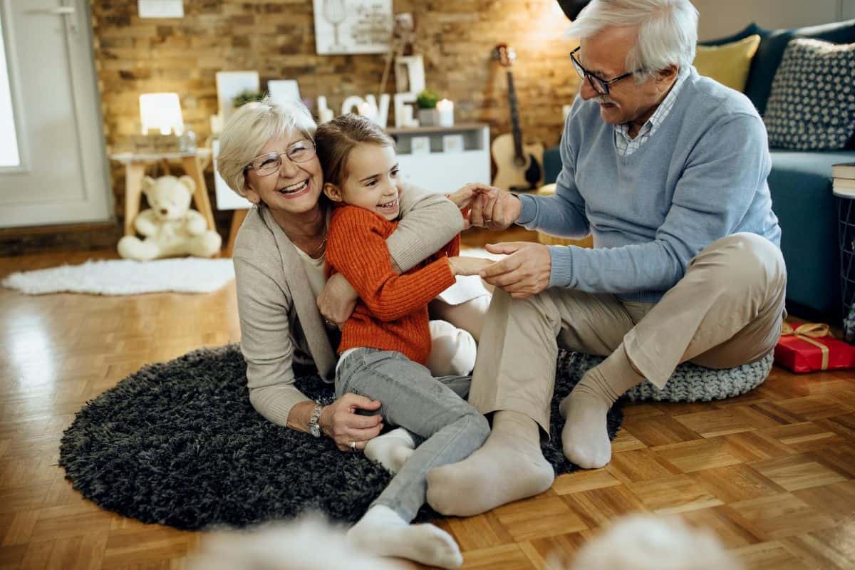 family of seniors with children in a living room
