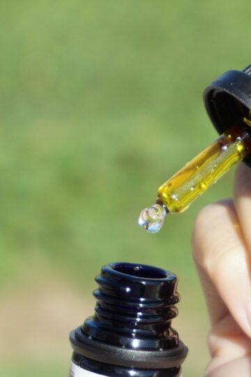 cbd oil in bottle with a dropper