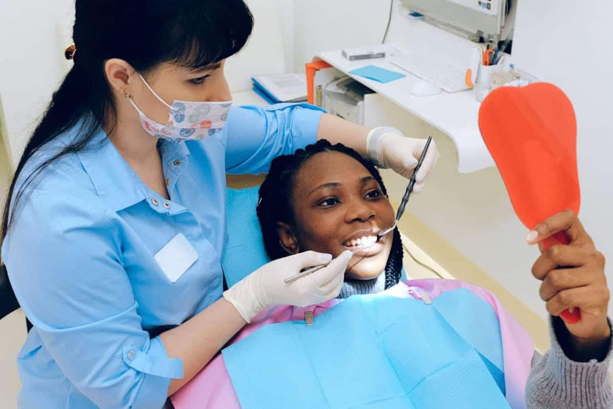 child getting their teeth cleaned by a dentist