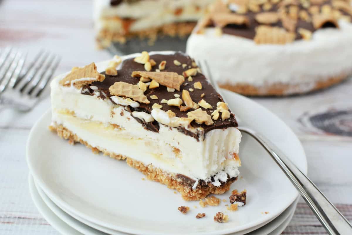 Close up shot of a Drumstick Ice Cream Cake with a slice cut out