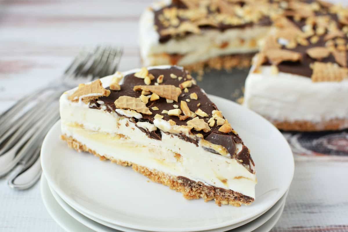 Close up shot of a Drumstick Ice Cream Cake with a slice cut out
