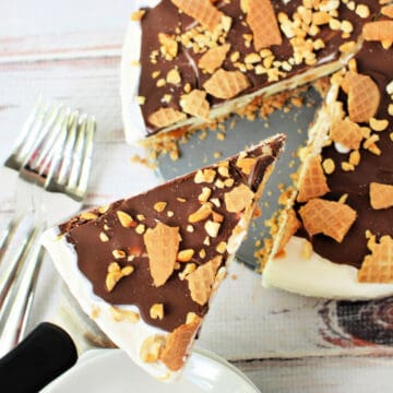 Close up shot of a Drumstick Ice Cream Cake with a slice cut out