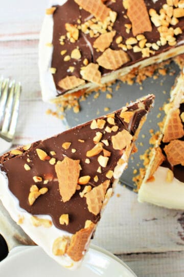 Close up shot of a Drumstick Ice Cream Cake with a slice cut out