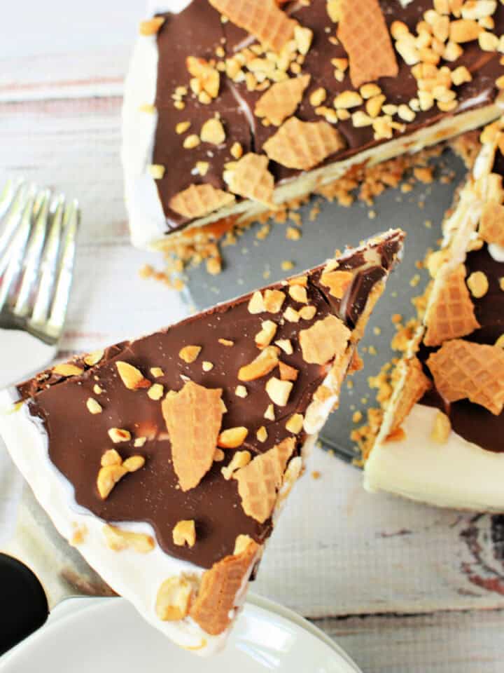 Close up shot of a Drumstick Ice Cream Cake with a slice cut out