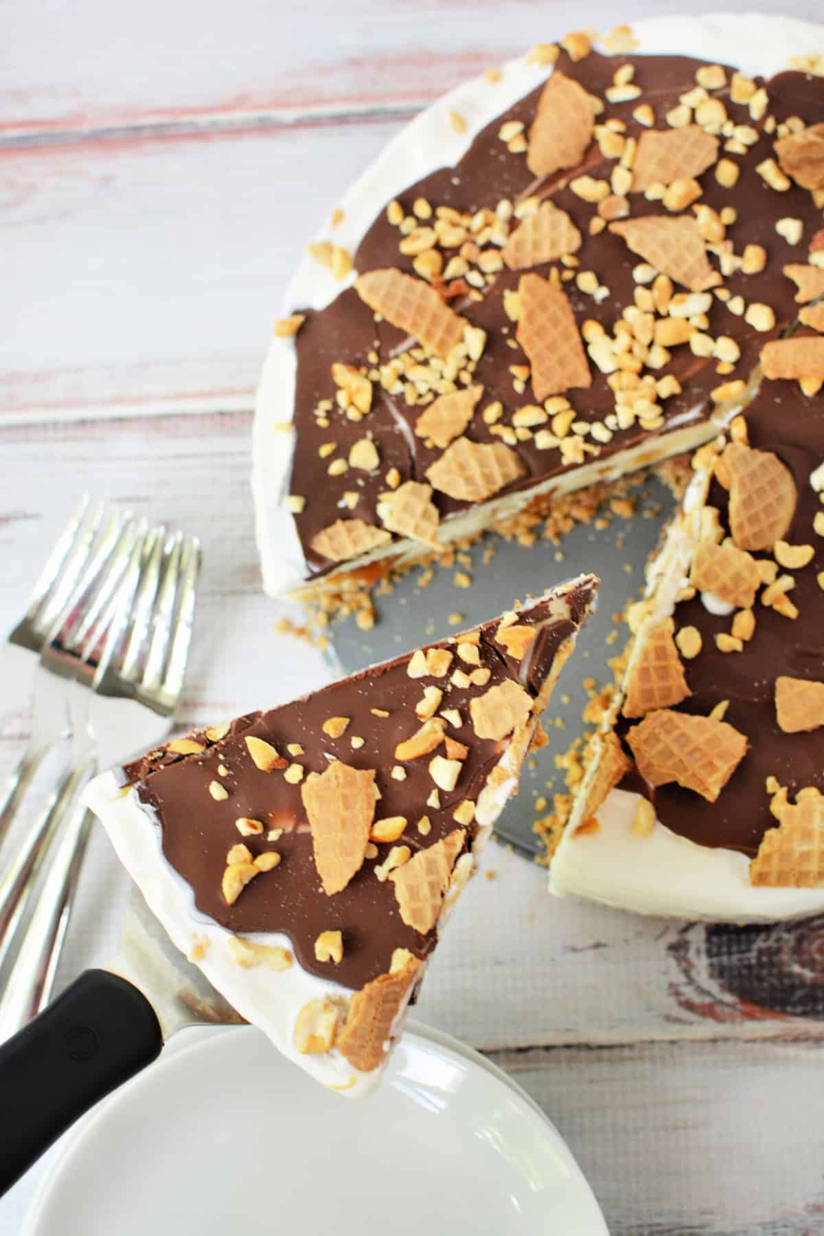 Close up shot of a Drumstick Ice Cream Cake with a slice cut out