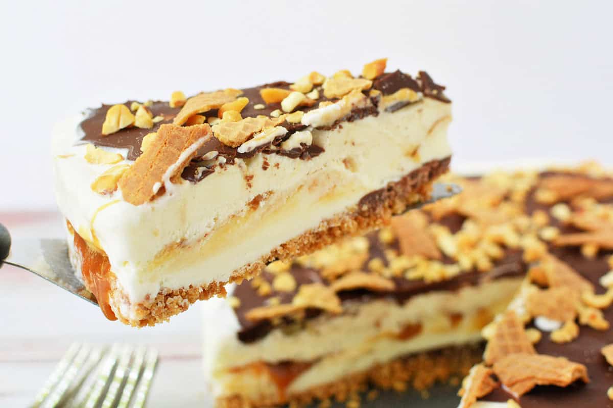 Close up shot of a Drumstick Ice Cream Cake with a slice cut out